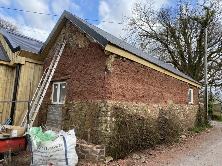 cob walls stripped to barn