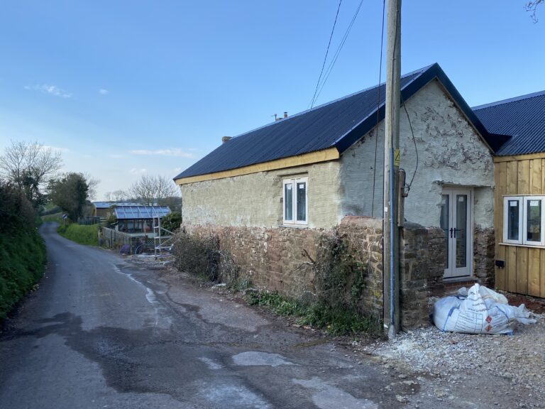 first coat of render to cobb walls